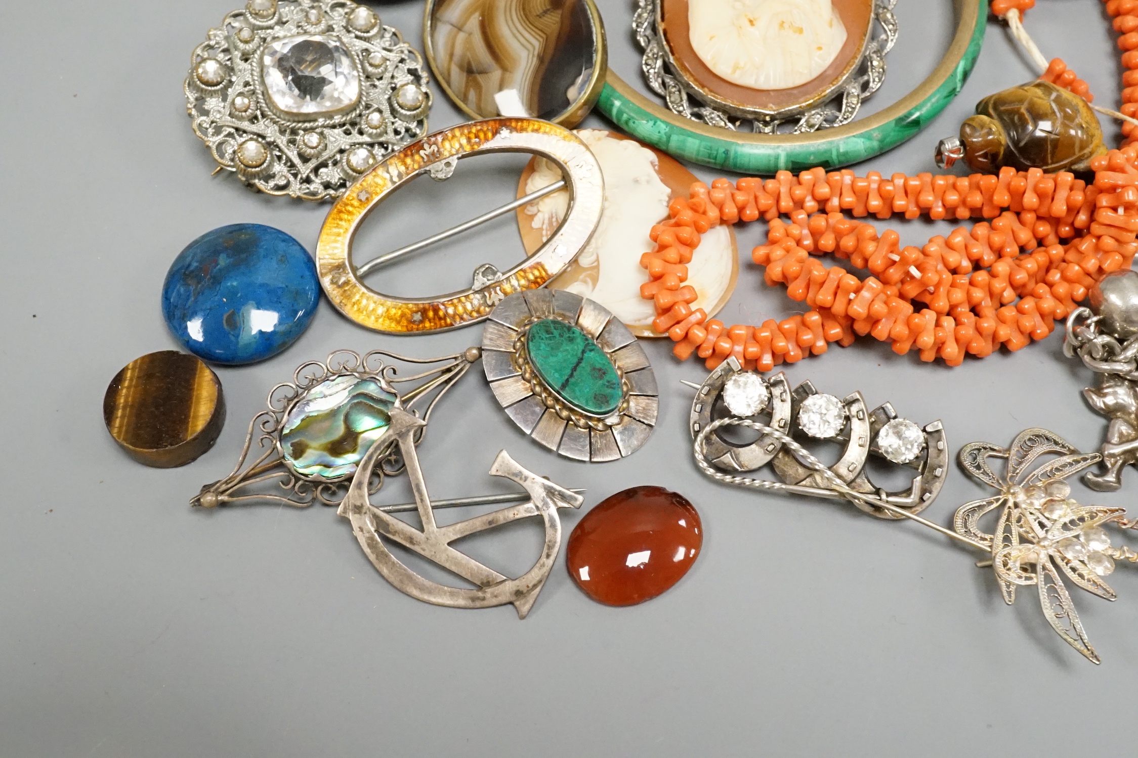A Victorian silver oval locket and other jewellery including and coral necklace and white metal charm bracelet stamped 'silver, etc.